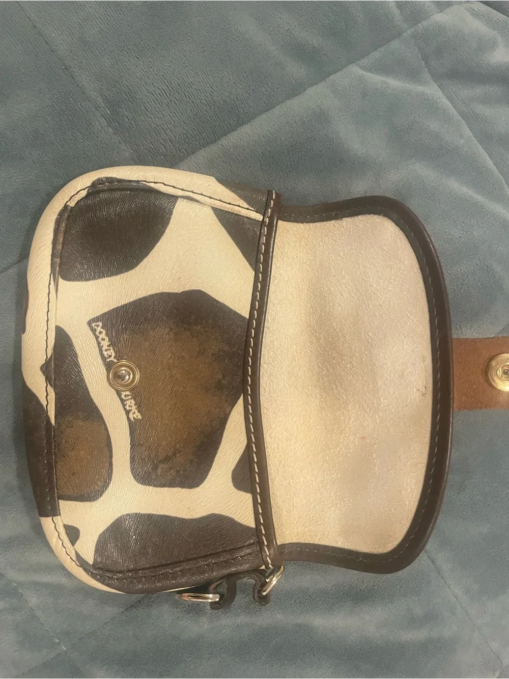 Dooney & Bourke Black and Cream Cow Print Leather Snap Wallet